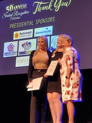 Rylee Rhineberger with representatives from Spherion Staffing [Photo by Sarah Nachin]