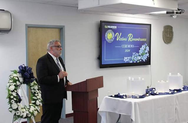 A video presentation for the fallen victims followed the lighting of the candles at the remembrance ceremony. [Photo by Austyn Szempruch]