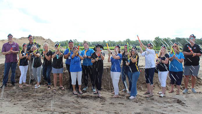 County Leaders and Rotary Club members don pirate hats and squirt guns to commemorate Monday's groundbreaking of the pirate-themed splash park. [Photo by Austyn Szempruch]