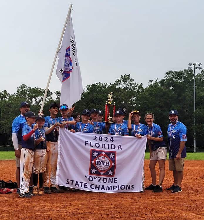 Coaches Mary Vercellona (second from right) and her 12u 