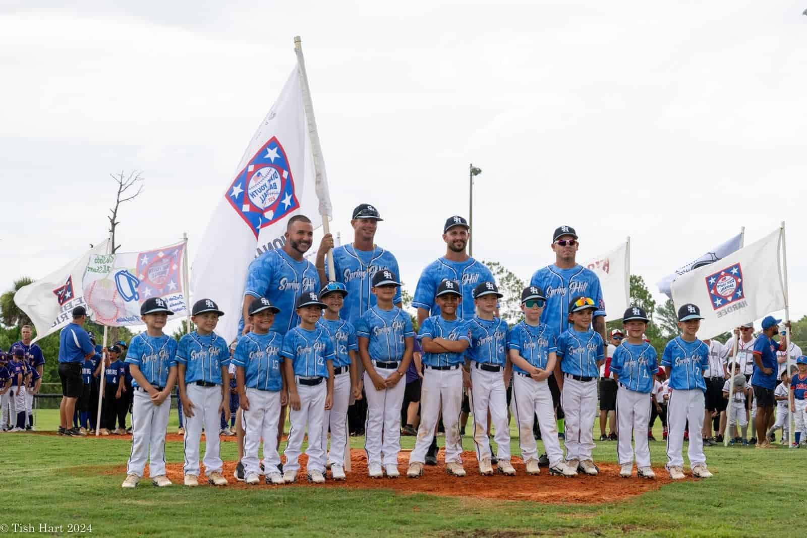 Spring Hill Dixie's 6-u team celebrates their state championship. [Photo by Tish Hart]