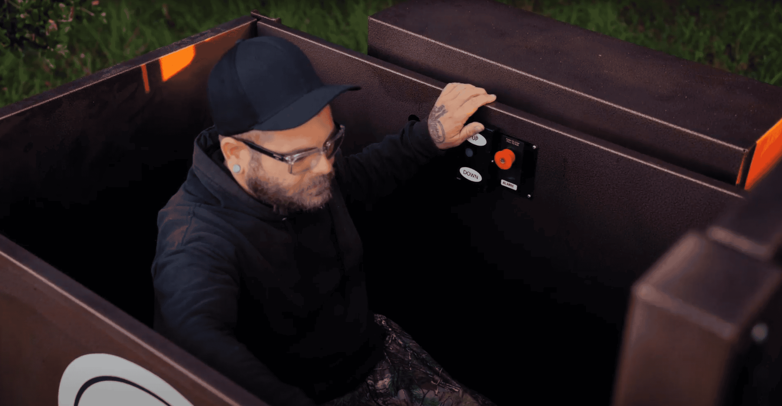 Disabled hunter Ryan Kress, secured inside the hunting tower elevator. [Promotional video screenshot]