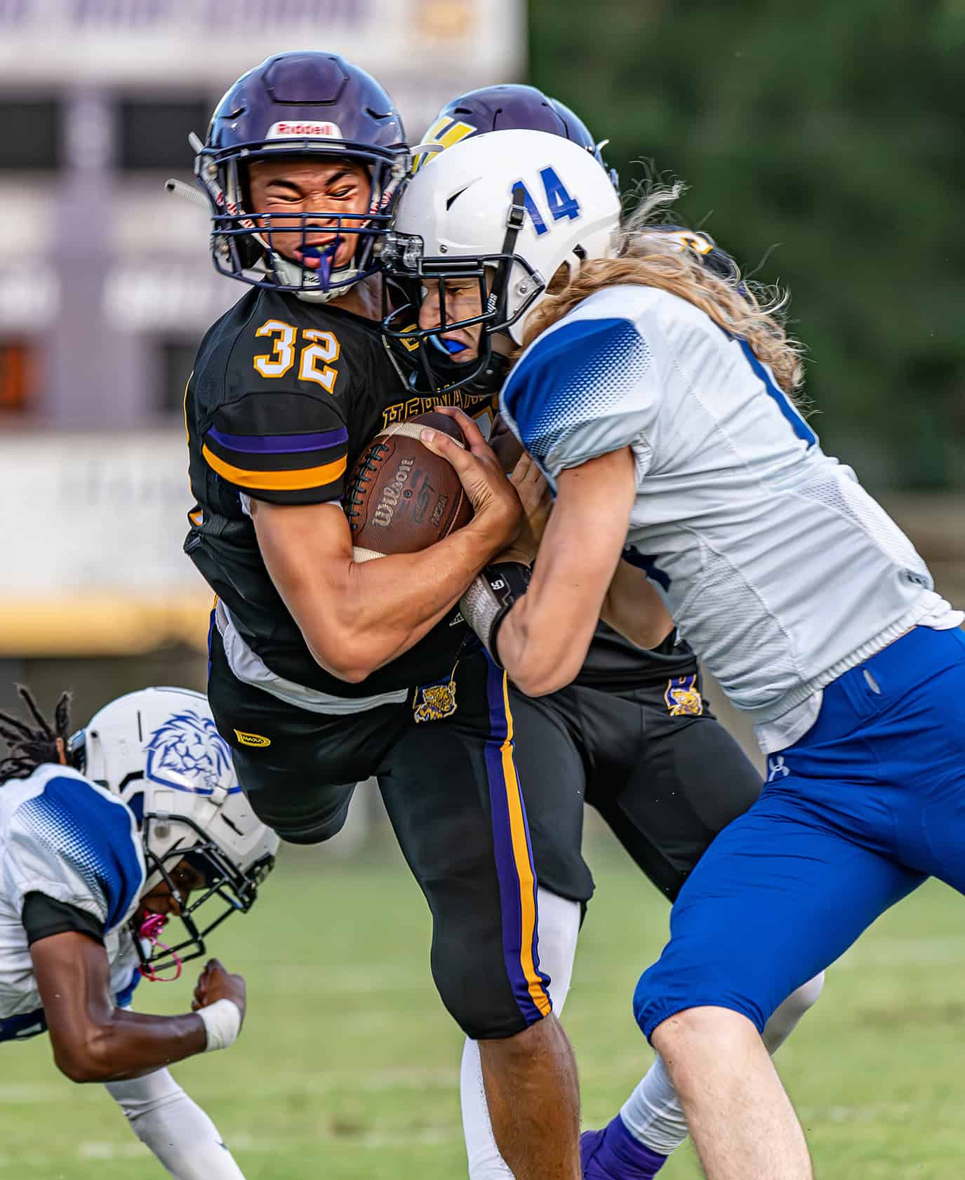 Hernando High , 32, Stevontae Hasberry had a sudden ending to a long gain by a helmet to helmet hit by Hollins High, 14, Christopher Levi Friday in Brooksville. [Photo by Joe DiCristofalo]