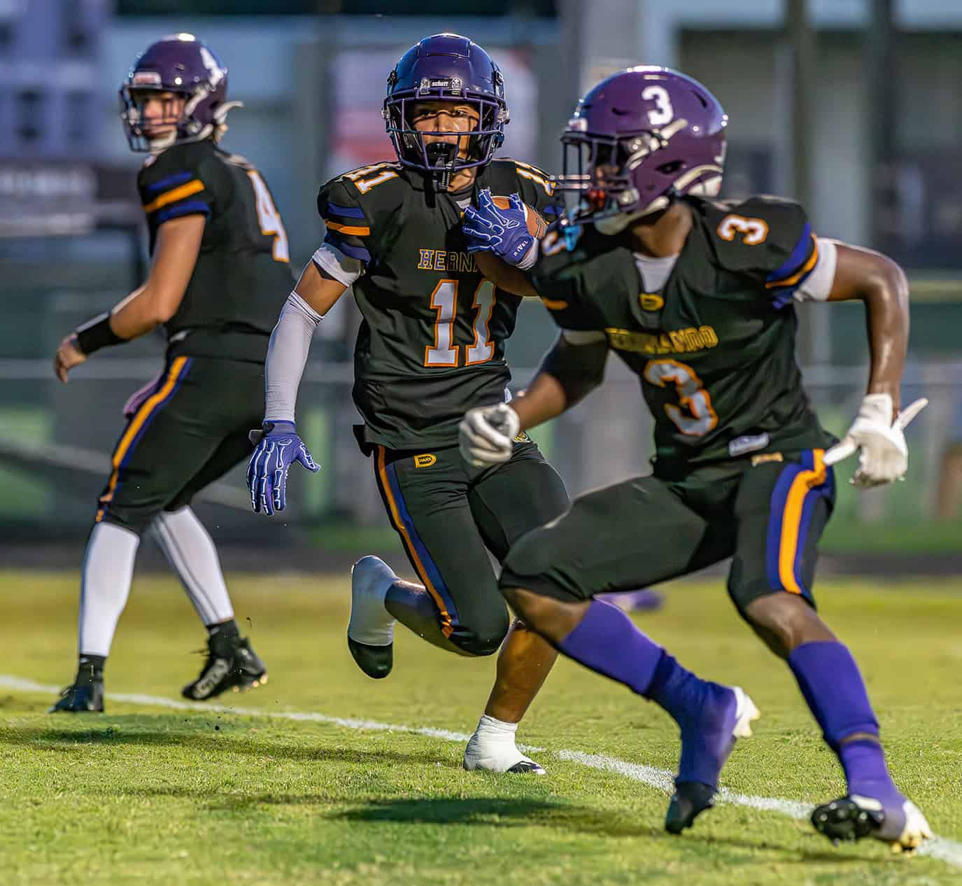 Hernando High running back, 11,  Kamoni Dotson runs for yardage against Hollins High School . [Photo by Joe DiCristofalo]