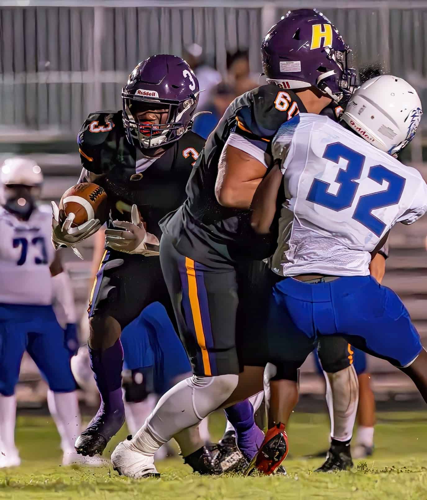 Hernando High ,60, Isaiah Daniels  provides a block to spring running back, 3, Jeremiah Brown  for a gain against visiiting Hollins High School Friday in Brooksville. [Photo by Joe DiCristofalo]