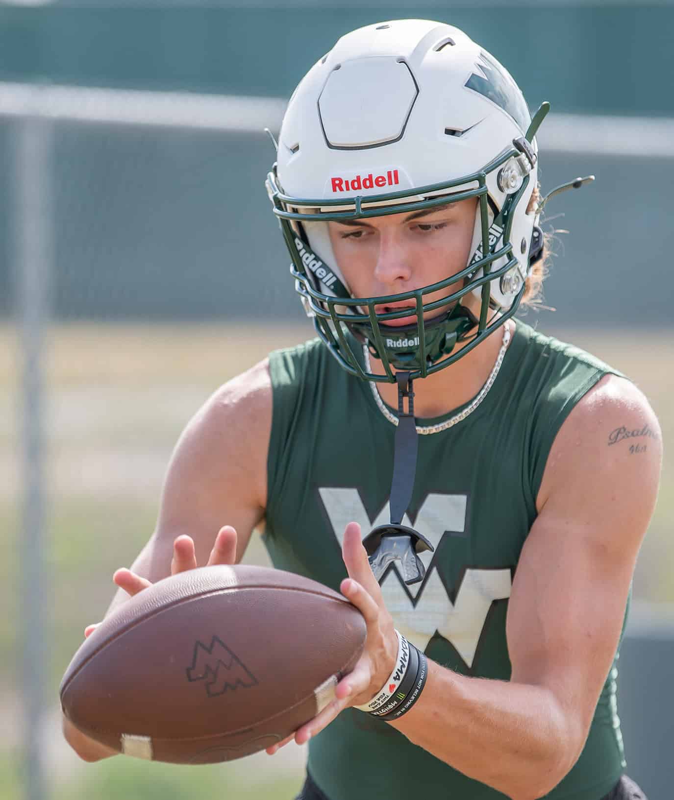 Weeki Wachee QB, Richard Hanshaw concentrates on receiving a snap Monday at practice. [Photo by JOE DiCRISTOFALO]