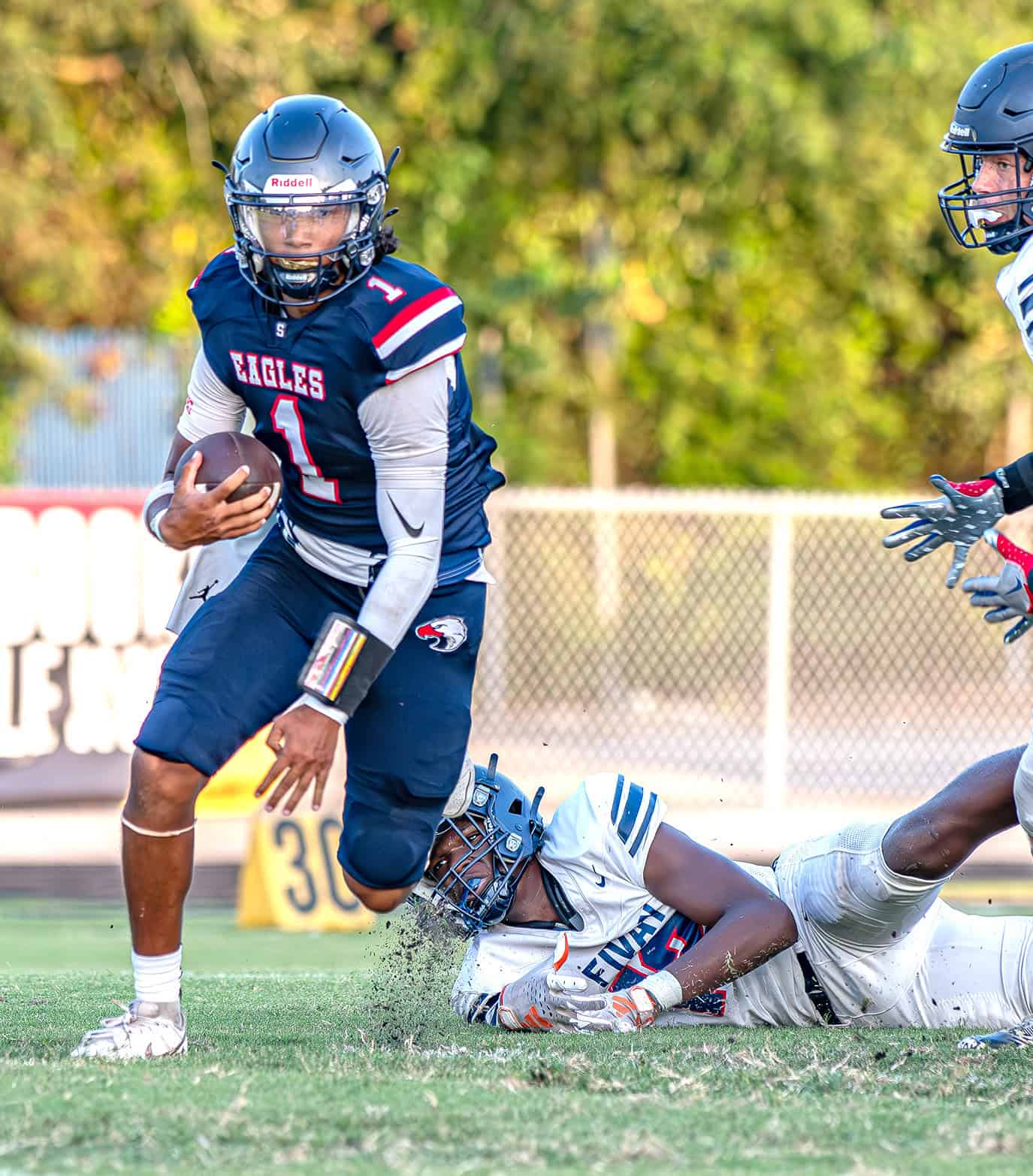 Springstead Quarterback , 1, Gil Martinez escapes a tackle for a gain against Fivay High School Friday at Booster Stadium. [Photo by Joseph DiCristofalo]