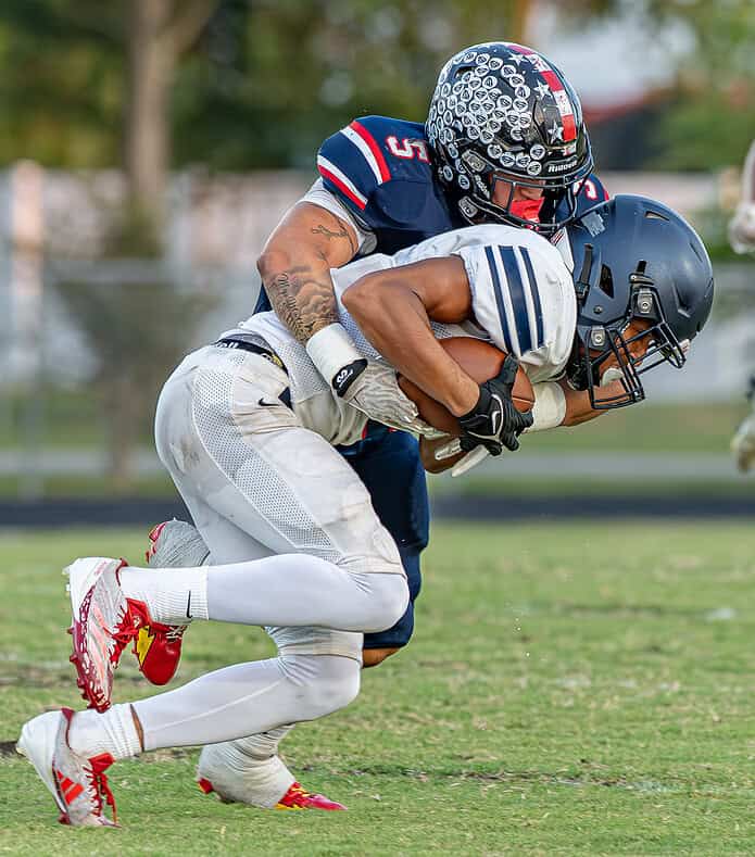 ABOVE: Springstead, 5, Jaidon James ends a run attempt by a Fivay High School running back Friday at Booster Stadium. [Photo by Joseph DiCristofalo]