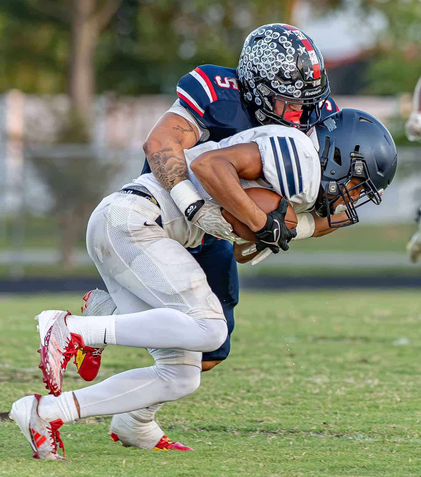 Springstead, 5, Jaidon James ends a run attempt by a Fivay High School running back Friday at Booster Stadium. [Photo by JOSEPH DiCRISTOFALO]