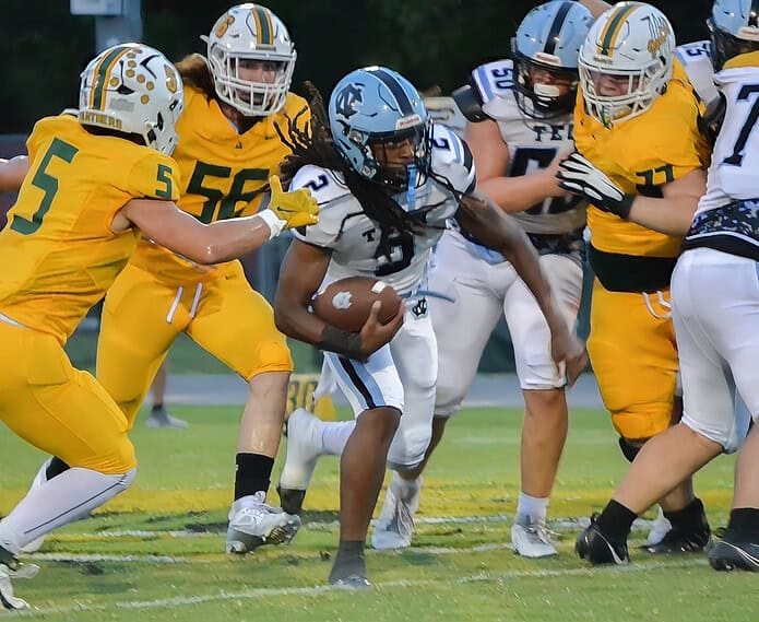 Timothy Gaynor carries the ball for Nature Coast against Lecanto during Friday's game in Citrus County. [Credit: Chris Bernhardt Jr.]