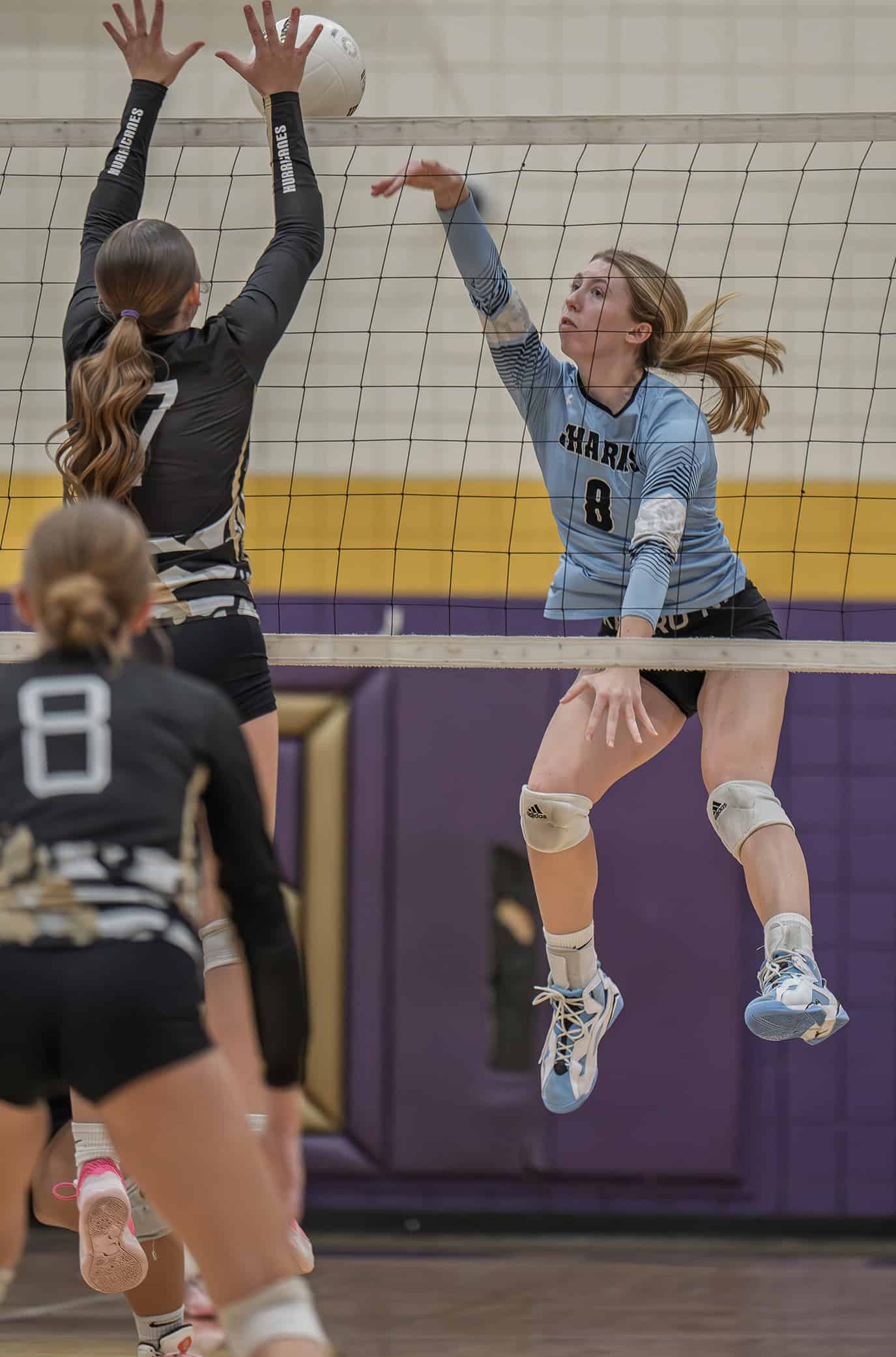 Nature Coast Tech, 8, Addison Carpenter slides ad shot cross court in the 4A District 8 playoff match with Citrus High. [Photo by Joe DiCristofalo]