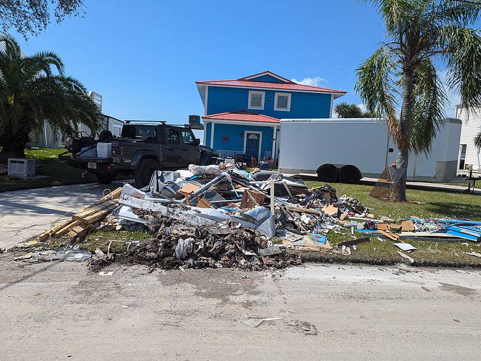 Hurricane Helene Debris in front of a Hernando Beach home. [Credit: Rocco Maglio]