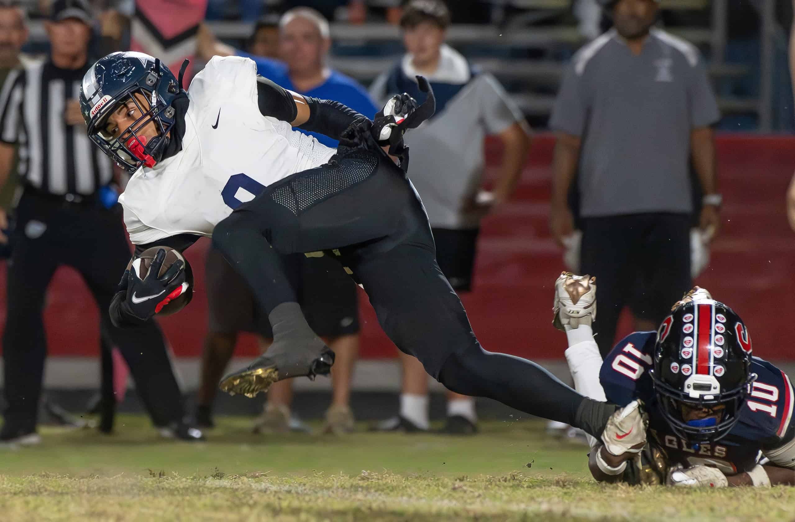 Springstead High, 10, Ivan Edwards makes a shoestring tackle on Gaither High, 9, Elija Mason during the game versus Gaither High Thursday at Booster Stadium. [Photo by Joe DiCristofalo]