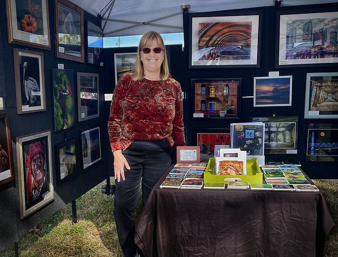 Joan LoBianco featuring her art for sale at the Front Porch Art Walk in Hernando Beach. The art walk is held the first Saturday of each month. [Photo courtesy of Joan LoBianco]