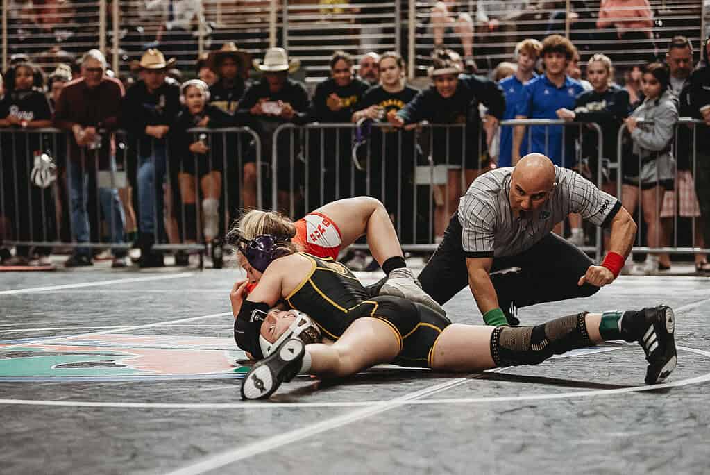 Emerson Webber (FR) of Hernando won by fall over Lily Bradshaw of Middleburg in a 100-pound match at the 2025 FHSAA State Wrestling Championships at Silver Spurs Arena in Kissimmee. [Photo by Cynthia Leota]