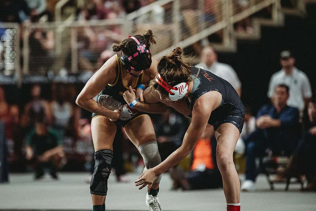 Keana Bush (SR) of Hernando looks for the takedown against Abigail Gonzalez of Miami Southridge in a 110-pound match at the 2025 FHSAA State Championships Finals. [Photo by Cynthia Leota]