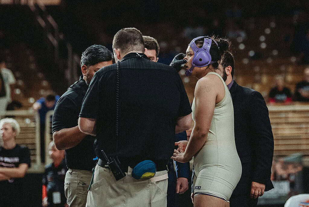 Grace Leota gets her nose plugged and taped after double blood time stops for nose bleed. [Photo by Cynthia Leota]