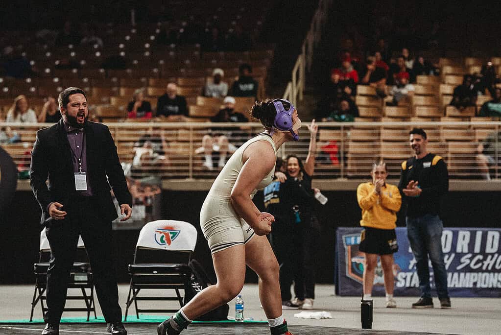 Grace Leota (SR) of Hernando celebrates winning her third State Wrestling Championship Title. [Photo by Cynthia Leota]