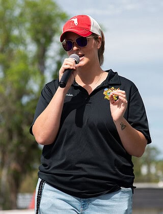 City of Brooksville Recreation and Community Program Manager Jordan Metzel addresses visitors at the grand opening of the splash pad at Tom Varn Park on March 1, 2025. [Photo by Jenifer Truitt]