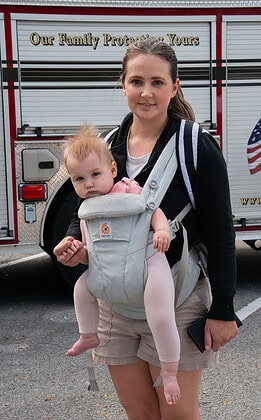 Tanya Carlson and baby at the Tom Varn Park splash pad grand opening on March 1, 2025. [Photo by Jenifer Truitt]