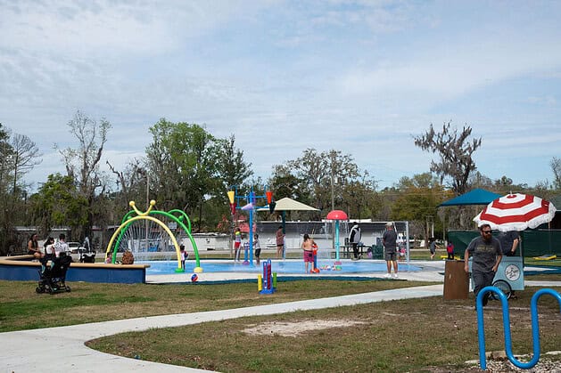 The grand opening of the splash pad at Tom Varn Park brought happy families out to play on March 1, 2025. [Photo by Jenifer Truitt]