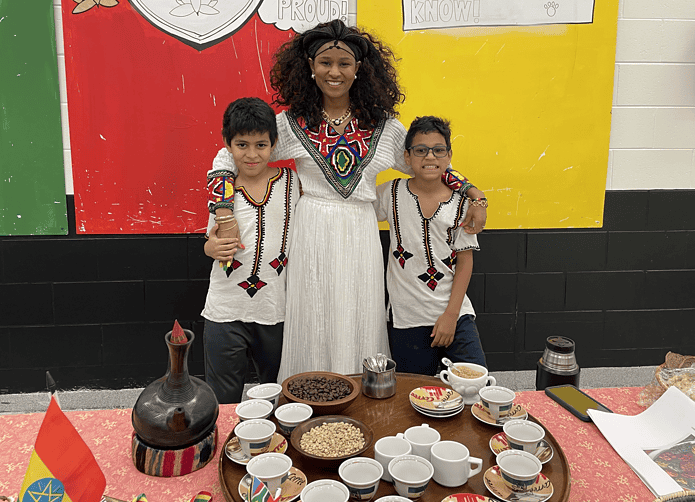 Genet Ozaltin and her two children, David, left and Sean, right representing Ethiopia Cultural Connections at Spring Hill Elementary on Feb. 20, 2025. [Photo by Sarah Nachin]