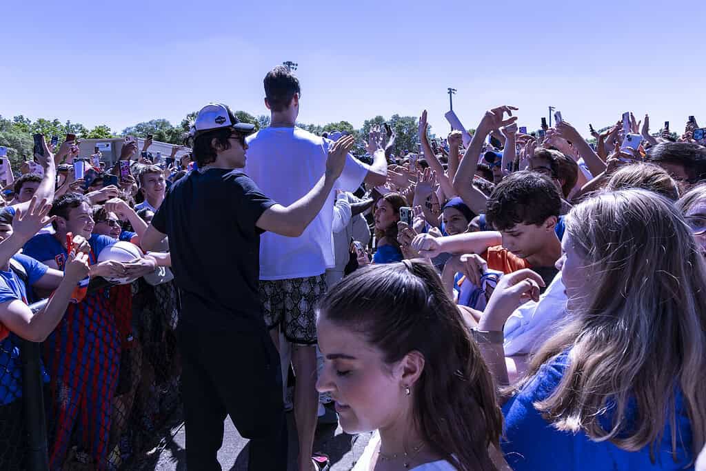 The Gators men's basketball team high-fives the hands of fans during the Championship Rally on Flavet Field in Gainesville, Fla., on Tuesday, April 8, 2025. (Photo by Hanna Maglio)