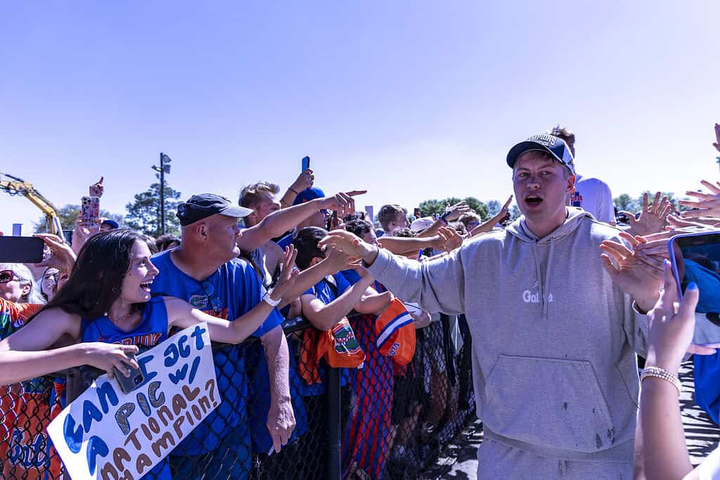 Bennett Andersen high-fives fans during the Championship Rally on Flavet Field in Gainesville, Fla., on Tuesday, April 8, 2025. (Photo by Hanna Maglio)