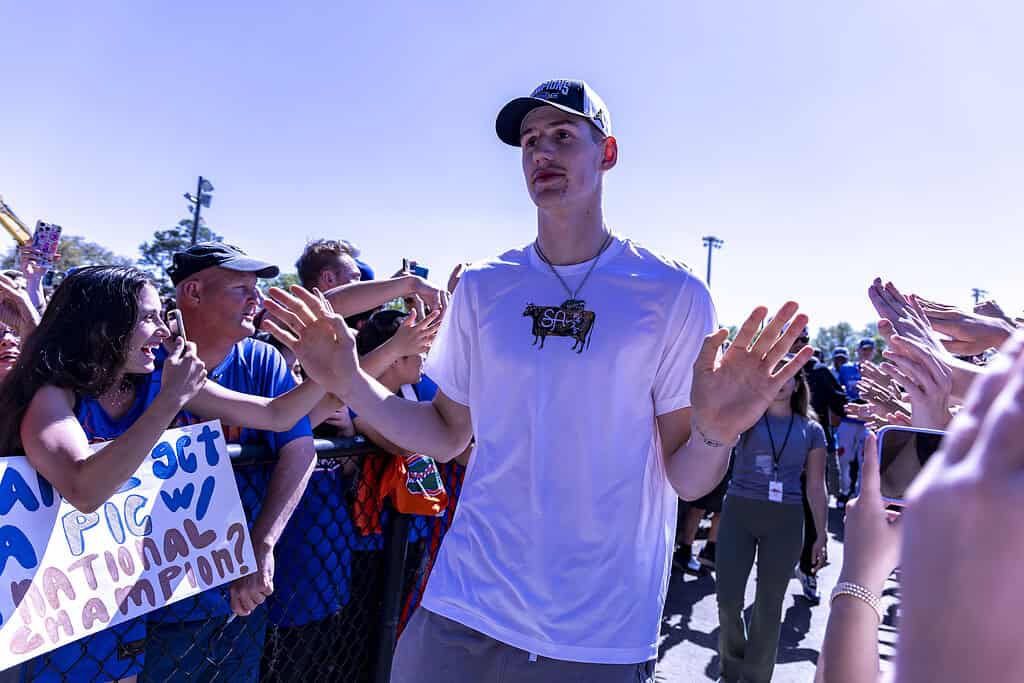 Alex Condon high-fives fans during the Championship Rally on Flavet Field in Gainesville, Fla., on Tuesday, April 8, 2025. (Photo by Hanna Maglio)