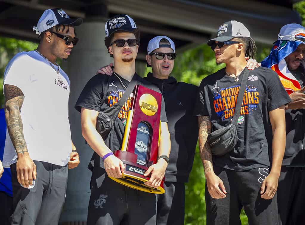 Walter Clayton, Jr. holds the NCAA men's basketball championship trophy at the Welcome Home rally in Gaineville, Fla. on April 8, 2025.