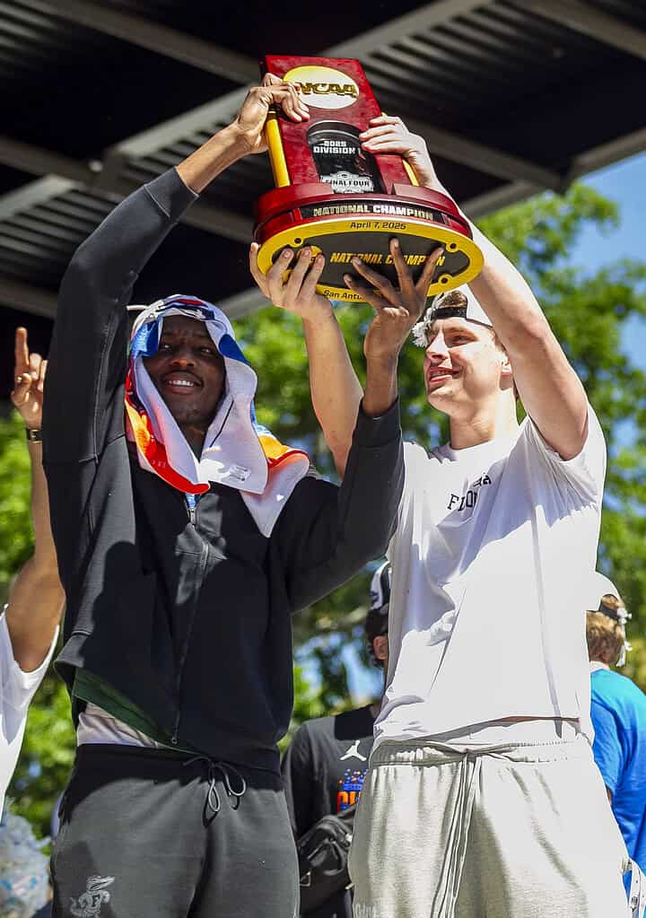 Rueben Chinyelu (left) and Micah Handlogten (right) hold up the NCAA Championship trophy during the Championship Rally on Flavet Field in Gainesville, Fla., on Tuesday, April 8, 2025. (Photo by Hanna Maglio)