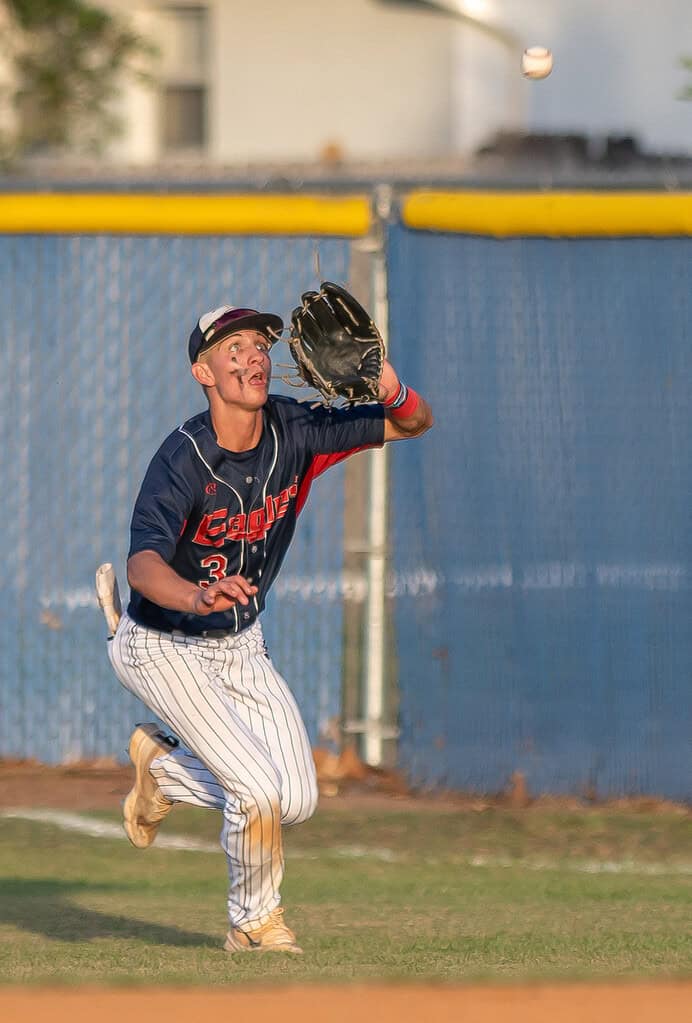 Springstead High right fielder Taryn Henrickson concentrates on catching a sinking line drive during the Thursday 5A playoff game between the Eagles and visiting New Smyrna Beach . [Photo by Joe DiCristofalo]