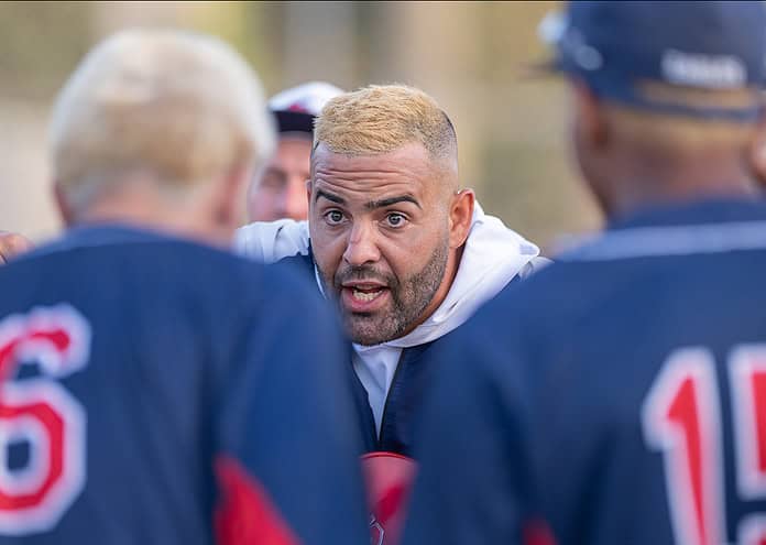 Springstead High Head Coach David Cazanas rallies his team before the last at bat in the Thursday 5A playoff game between the Eagles and visiting New Smyrna Beach . [Photo by Joe DiCristofalo]